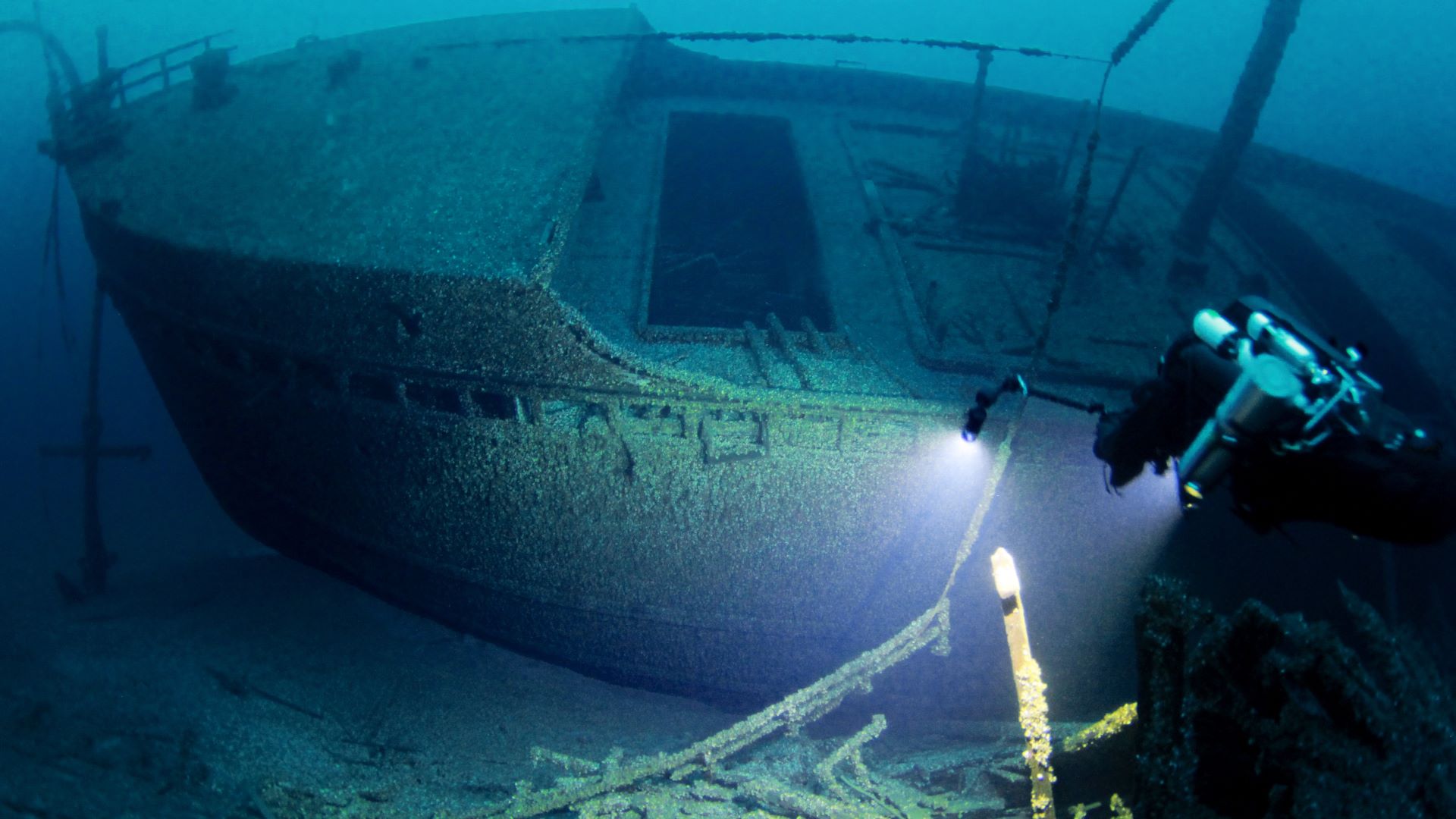 Wreck structure emerging from dark Great Lakes water