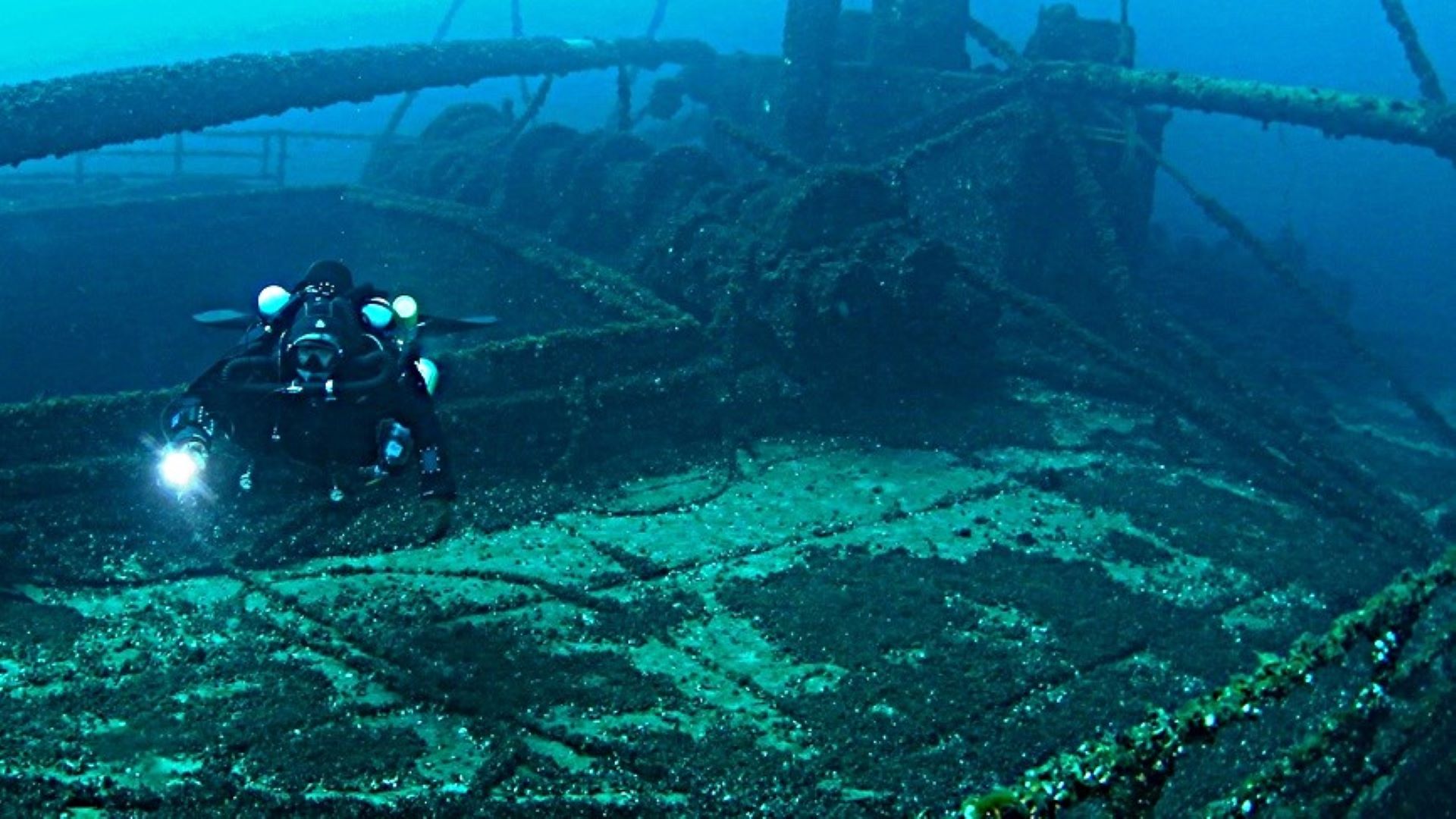 Diver approaching preserved Great Lakes wreck structure
