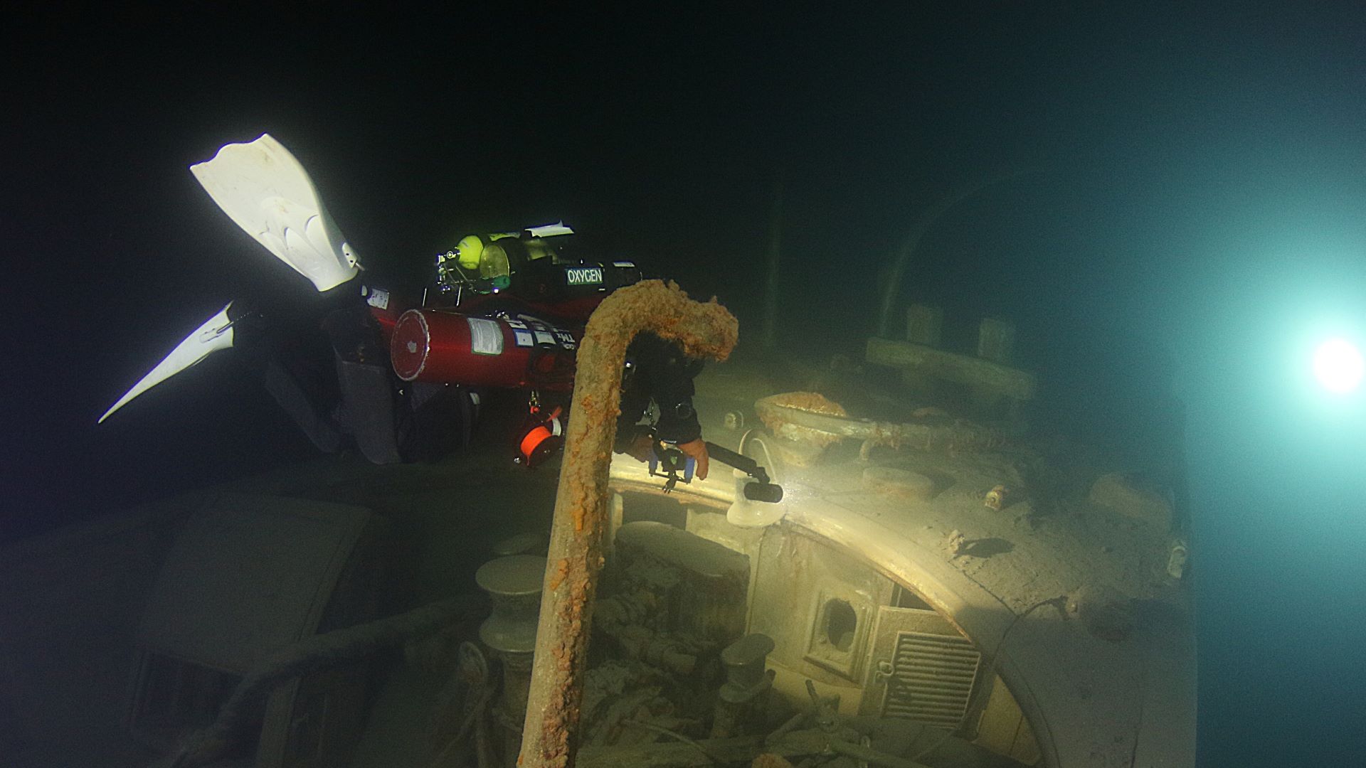 Wreck silhouette emerging in Great Lakes water