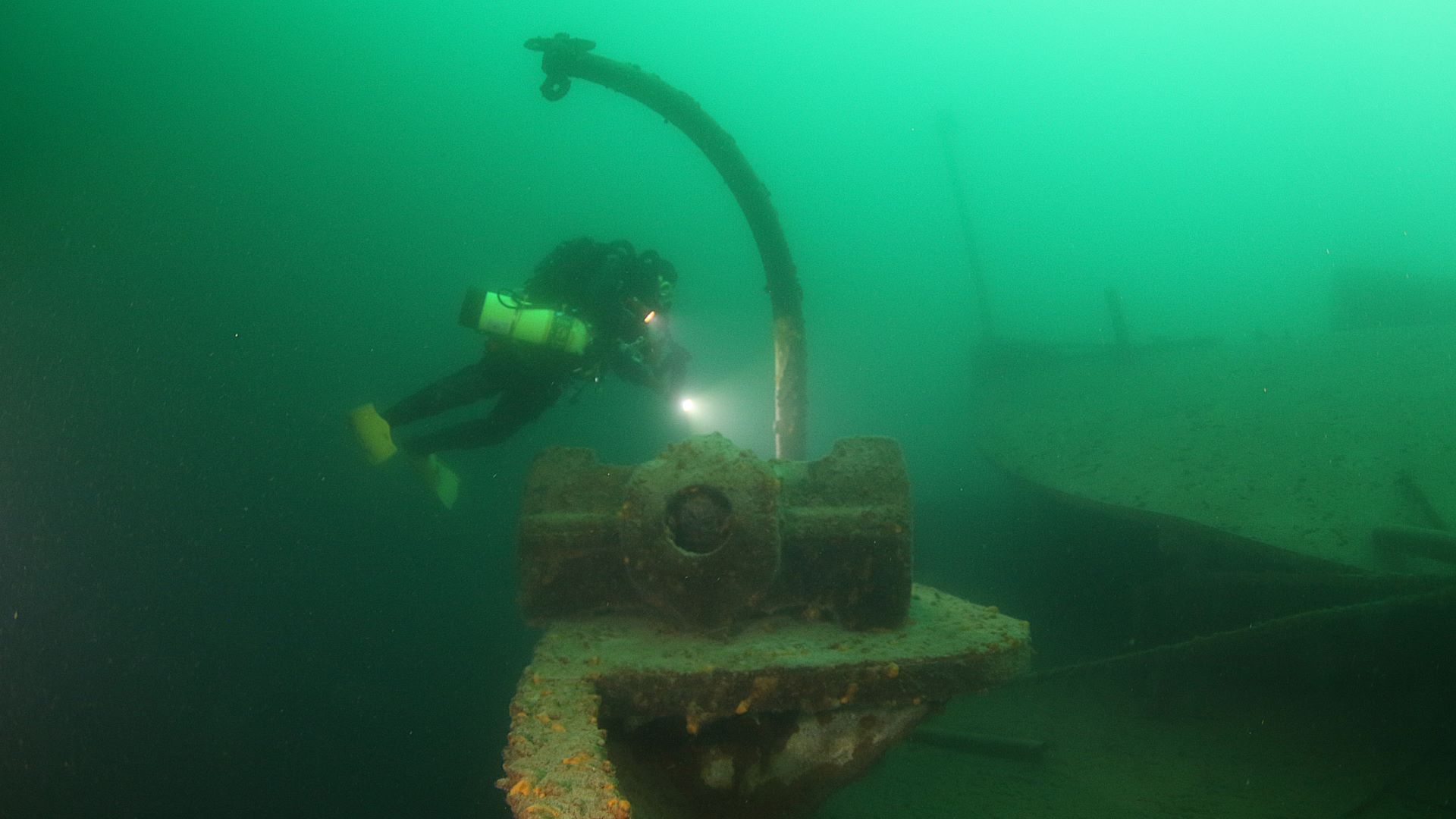 Historic wreck scene in dark freshwater