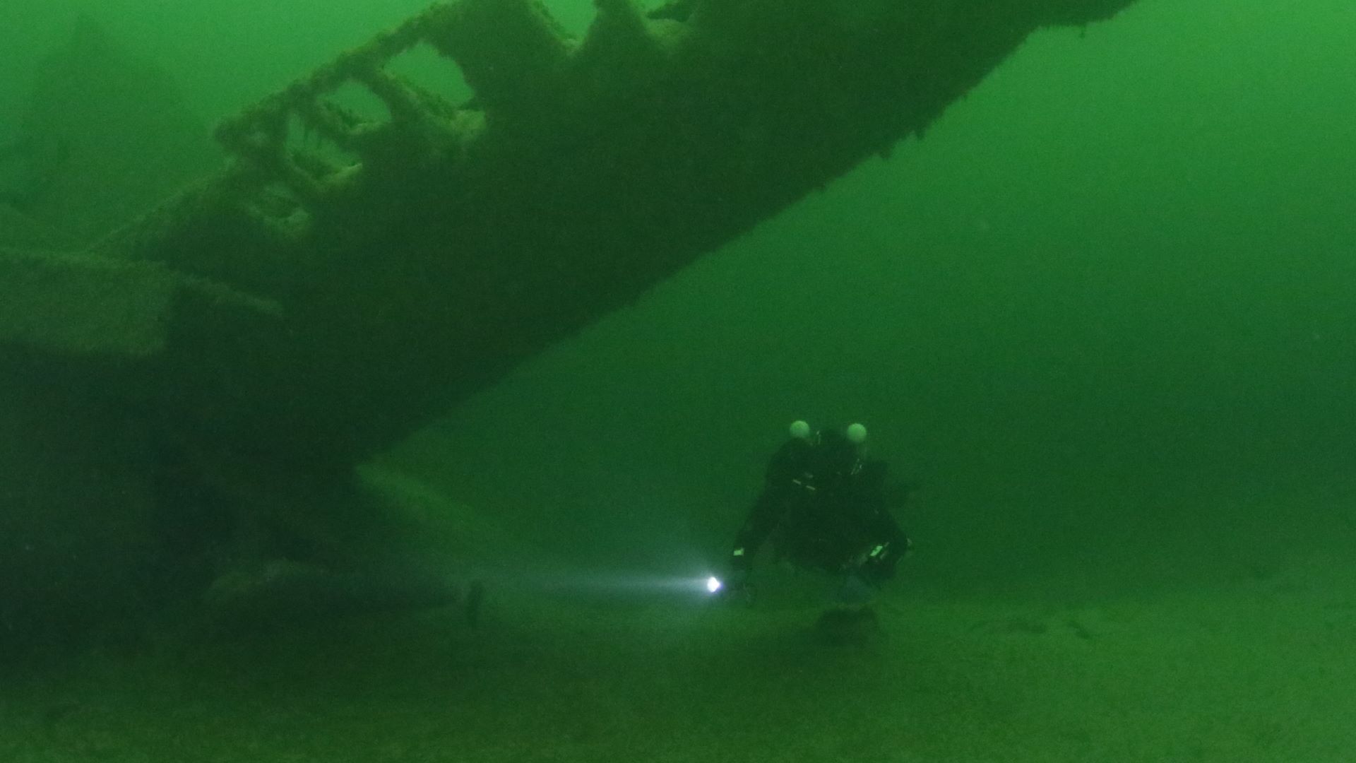 Dive team gear check before wreck dive