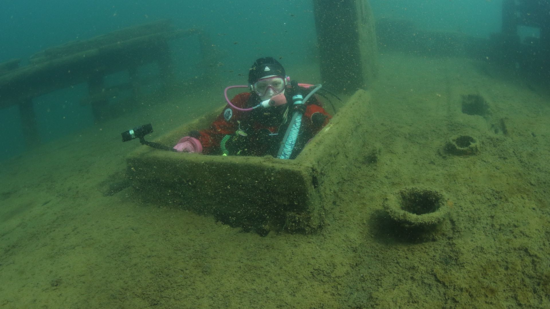 Diver carefully approaching a wreck